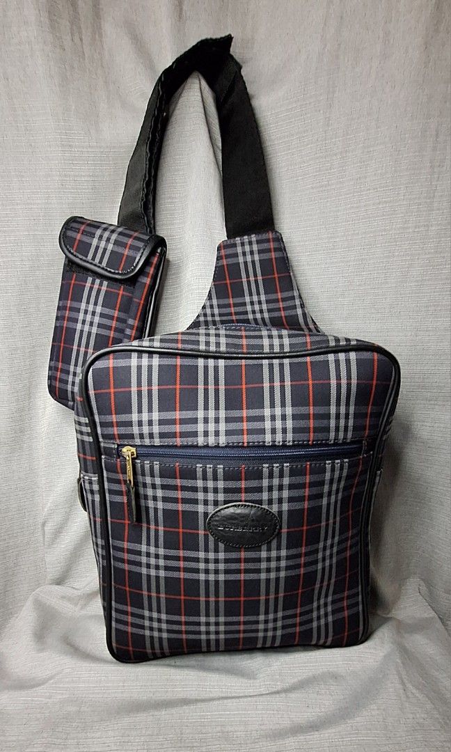 Burberry Crossbody Bag for Men (Category: Luxury Bags & Wallets) located in Pasig City. Submitted by fjrd_relovedluxury28 (Listing ID 1341300842, Image 1). Description: Selling this Authentic, Vintage, pre-loved Burberry Body Bag in Medium. Canvass color is still vibrant with no holes and rubs. Zipper functions well. No cracks on pipings and interior liner. Comes with a Celphone pouch which can fit 6.5inches. Message us for negotiation..