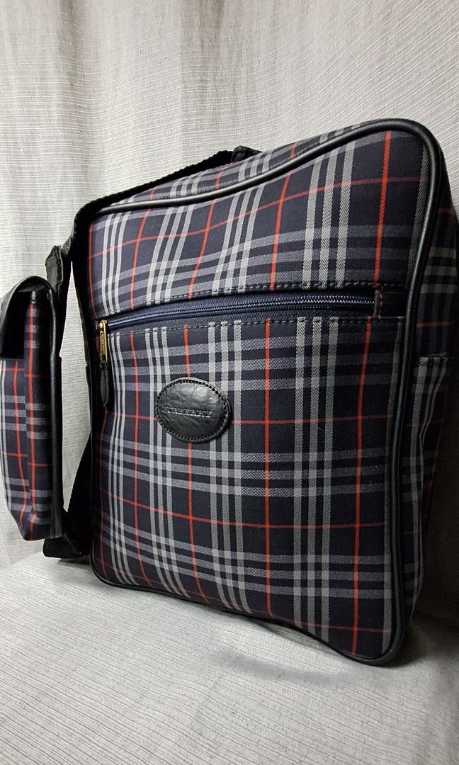 Burberry Crossbody Bag for Men (Category: Luxury Bags & Wallets) located in Pasig City. Submitted by fjrd_relovedluxury28 (Listing ID 1341300842, Image 3). Description: Selling this Authentic, Vintage, pre-loved Burberry Body Bag in Medium. Canvass color is still vibrant with no holes and rubs. Zipper functions well. No cracks on pipings and interior liner. Comes with a Celphone pouch which can fit 6.5inches. Message us for negotiation..