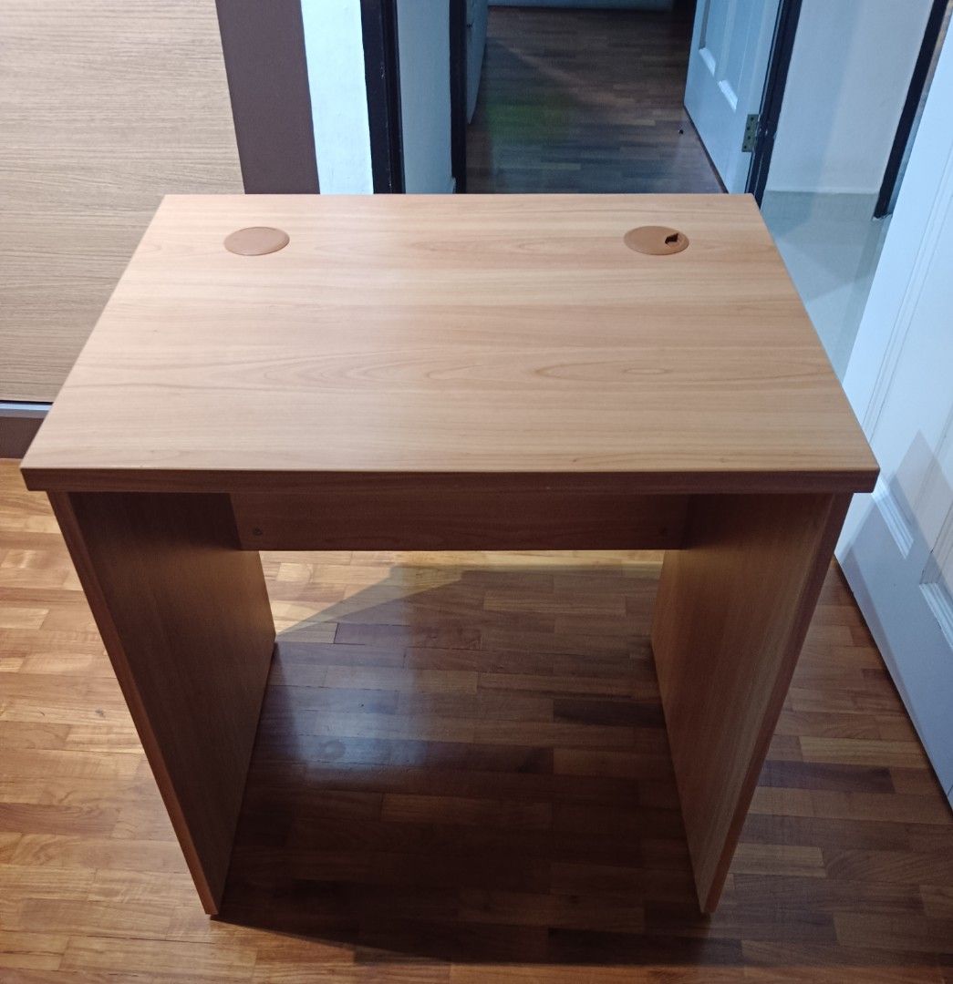 Study table (Category: Tables & Sets) located in Singapore. Submitted by tinazman (Listing ID 1341351674, Image 2). Description: - Sturdy wood table in pristine condition (no scratches/defects) - Perfect for small rooms/spaces - No dismantling required and easy to carry - Dimensions: 70 x 55 x 74cm - Cash & carry preferred but delivery can be arranged for a small fee.