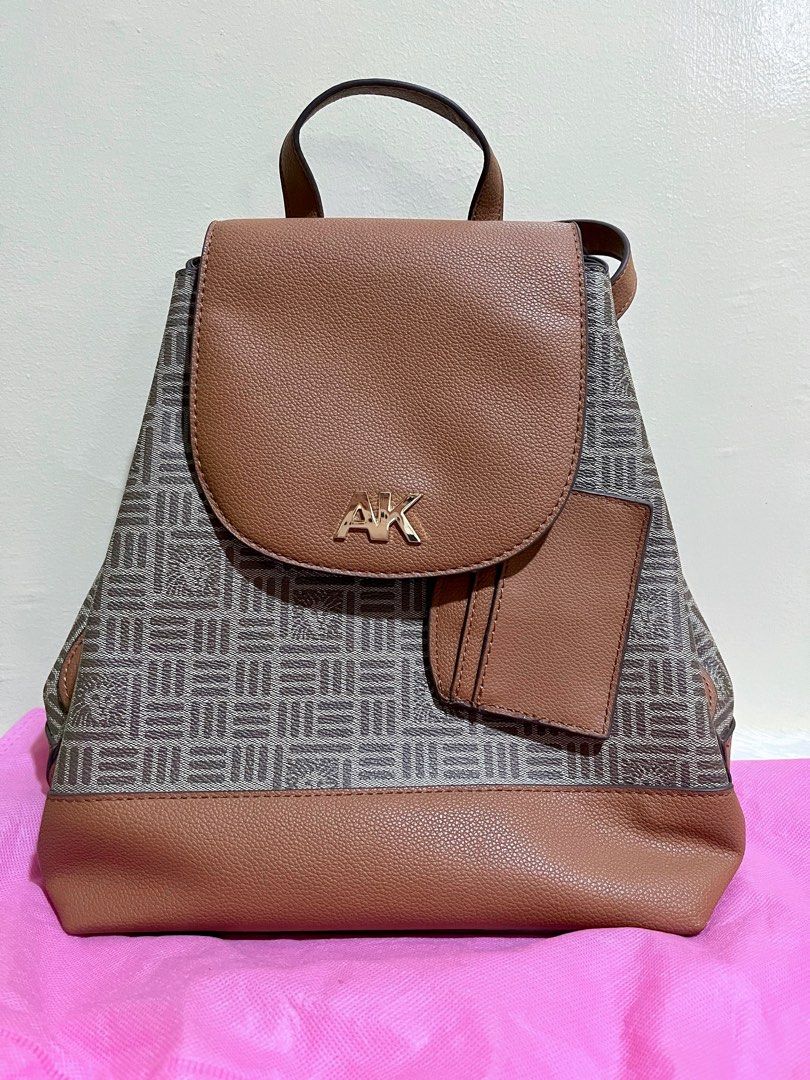 ANNE KLEIN Logo Flap Backpack with Card Carrier (Category: Backpacks) located in Morong. Submitted by kyrosscradle (Listing ID 1341512793, Image 1). Description: ANNE KLEIN Logo Flap Backpack with Card Carrier 🧡 Condition: - 100% Authentic - preloved, lightly used, with minimal flaw (may small cracked na lining sa may upper part ng strap (see photo na lang please) 🧡 Features: - Medium-sized backpack - Made with faux leather, polyester lining - 