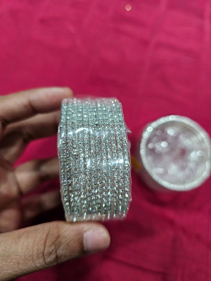 Bangles (Category: Accessory holder, box & organizers) located in Singapore. Submitted by djsidifjdk (Listing ID 1341571435, Image 4). Description: silver colour with stones 1 pack 12 pic total 2 pack each $10 size 2.4.