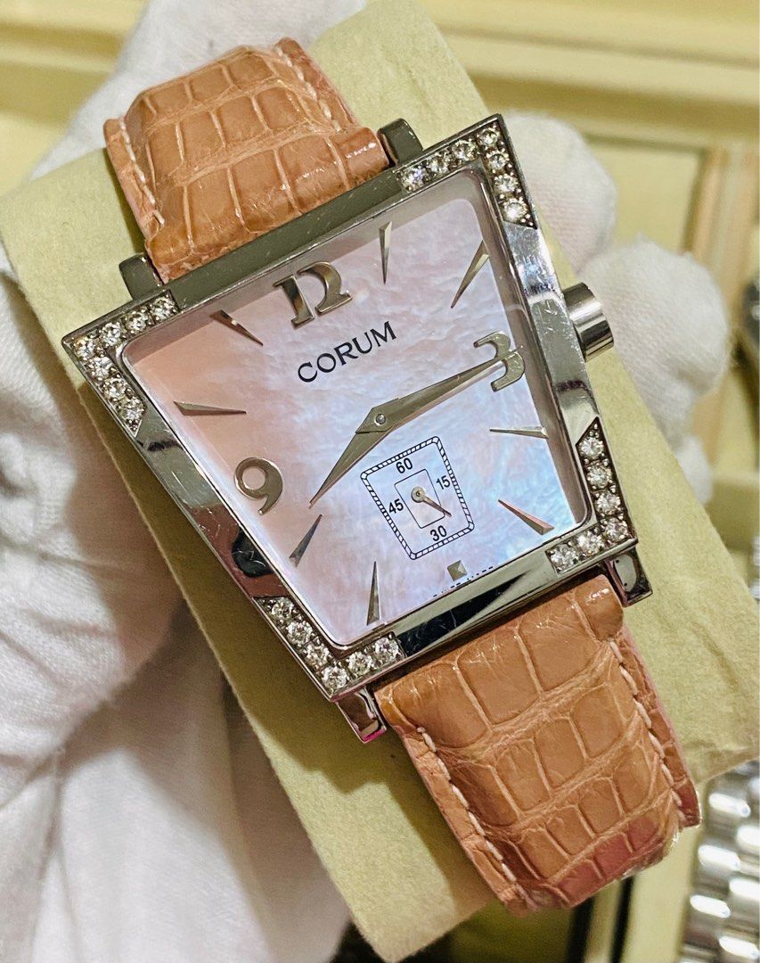 Corum Watch (Category: Luxury Watches) located in Baliuag. Submitted by clicksmileph (Listing ID 1341576373, Image 3). Description: Corum Trapeze Watch 58,000 Quartz Movement 34mm Case size ; Unisex Watch Stainless Steel Case Pink Leather Strap 8.5/10 all working, good condition Swiss Made Guaranteed Authentic Set with: Watch & Presentation box LBC Cash on Delivery Meet-up around Bulacan / Metro Manila .