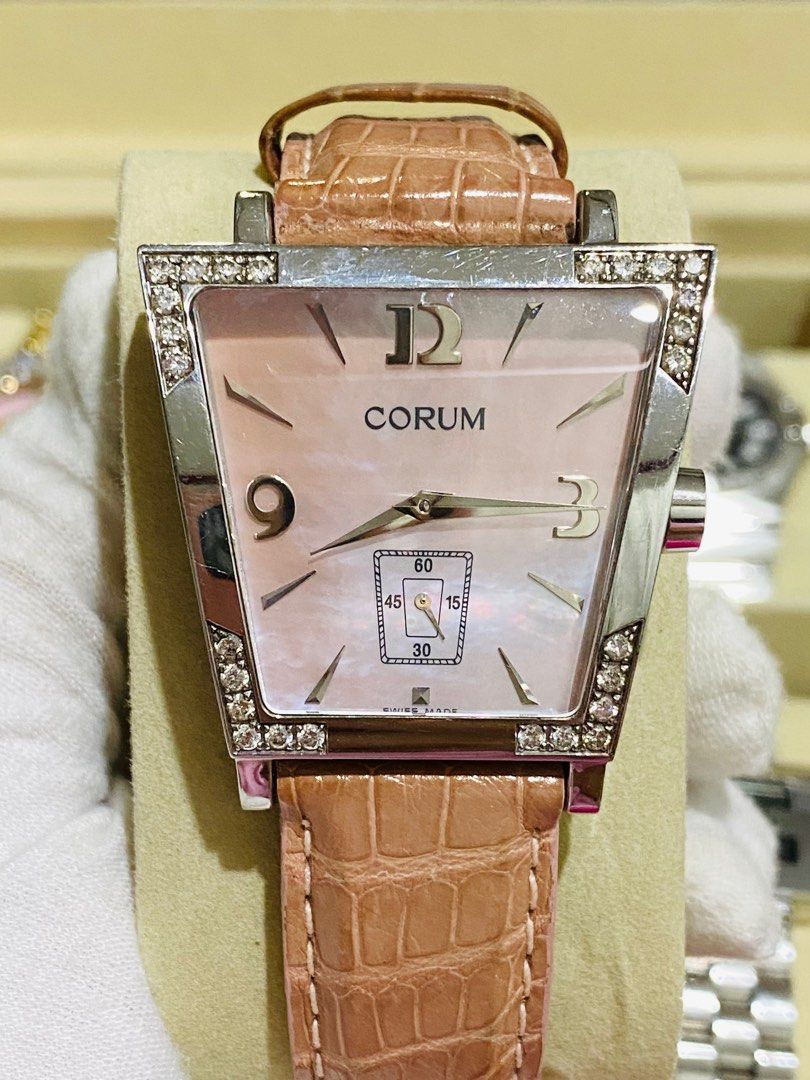 Corum Watch (Category: Luxury Watches) located in Baliuag. Submitted by clicksmileph (Listing ID 1341576373, Image 1). Description: Corum Trapeze Watch 58,000 Quartz Movement 34mm Case size ; Unisex Watch Stainless Steel Case Pink Leather Strap 8.5/10 all working, good condition Swiss Made Guaranteed Authentic Set with: Watch & Presentation box LBC Cash on Delivery Meet-up around Bulacan / Metro Manila .