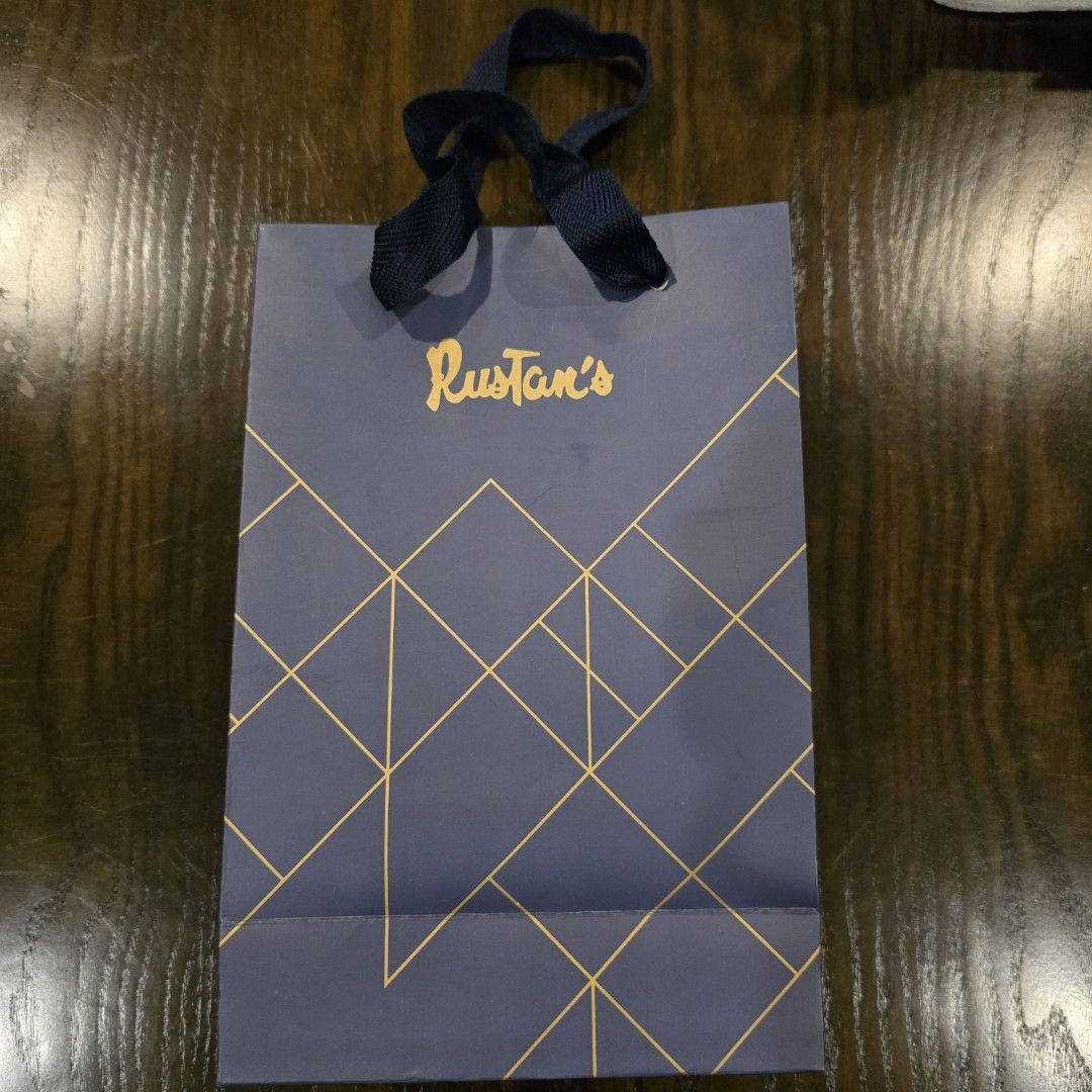 Rustans medium and large paper bag (Category: Luxury Bags & Wallets) located in San Juan City. Submitted by super.saver8 (Listing ID 1341523175, Image 1). Description: medium - 200 large - 300.