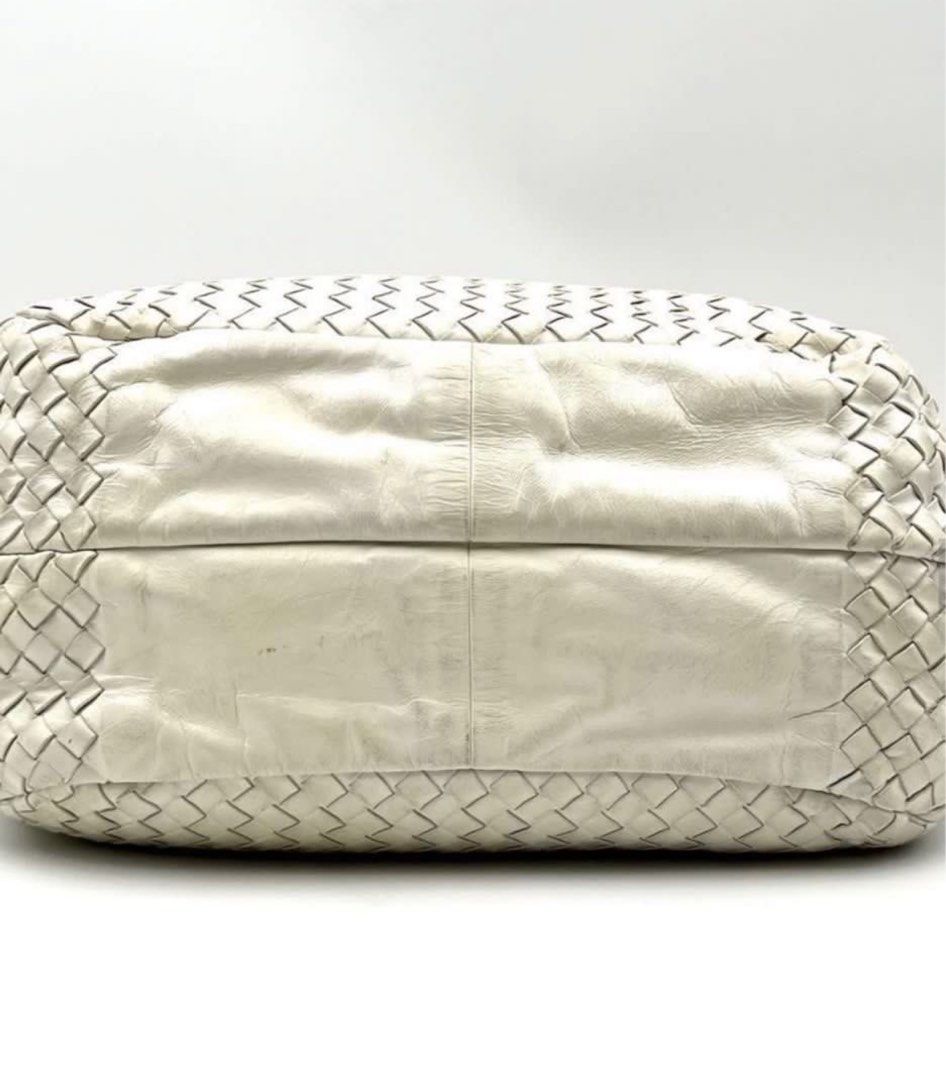 Authentic Bottega Veneta Campana (Category: Luxury Bags & Wallets) located in Manila. Submitted by beansentoo (Listing ID 1341704553, Image 3). Description: Authentic Bottega Veneta Campana Color: White Size: Medium Preloved price in other stores is at $1,655 (7*93,000) Asking price: P35,000 Selling low because of pen marks inside the bag and some cracks underneath the handle. Not noticeable when worn Inclusions: Bag (card and dust bag not includ