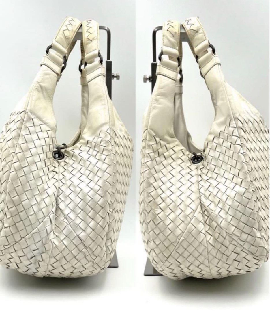 Authentic Bottega Veneta Campana (Category: Luxury Bags & Wallets) located in Manila. Submitted by beansentoo (Listing ID 1341704553, Image 2). Description: Authentic Bottega Veneta Campana Color: White Size: Medium Preloved price in other stores is at $1,655 (7*93,000) Asking price: P35,000 Selling low because of pen marks inside the bag and some cracks underneath the handle. Not noticeable when worn Inclusions: Bag (card and dust bag not includ
