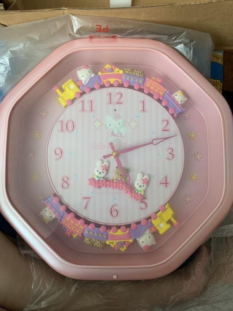 HELLO KITTY JAPAN - CITIZEN WALL CLOCK (Category: Clocks) located in Pasig City. Submitted by smcmj_preloved (Listing ID 1341622316, Image 1). Description: Hello Kitty Marionette Clock Code: M766 - 4MH766-013 Citizen Color: Pearl Pink Size: 37 X 37 X 10 cm Box Size: 43 X 43 X 14 cm Movement in Japan - Cased in China. Sold in Japan Only. This Citizen product is from 2000. I have kept this since I received it, part of my Hello Kitty Collections. Th