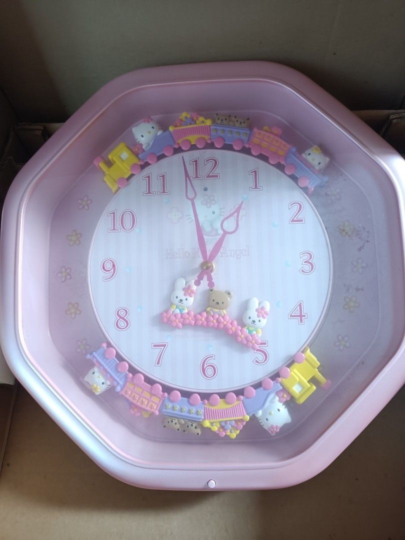 HELLO KITTY JAPAN - CITIZEN WALL CLOCK (Category: Clocks) located in Pasig City. Submitted by smcmj_preloved (Listing ID 1341622316, Image 2). Description: Hello Kitty Marionette Clock Code: M766 - 4MH766-013 Citizen Color: Pearl Pink Size: 37 X 37 X 10 cm Box Size: 43 X 43 X 14 cm Movement in Japan - Cased in China. Sold in Japan Only. This Citizen product is from 2000. I have kept this since I received it, part of my Hello Kitty Collections. Th