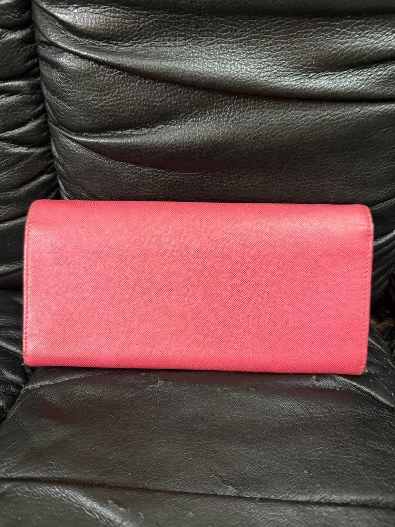 Prada Crossbody Long Wallet (Category: Luxury Bags & Wallets) located in Pasig City. Submitted by armoire_deluxe (Listing ID 1341716212, Image 2). Description: Pre💕 item. In good condition. No sling.