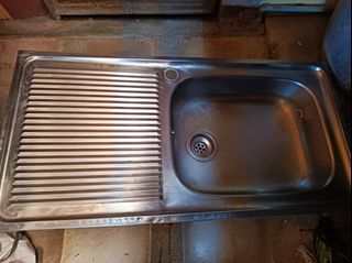 Stainless steel long well used sink
