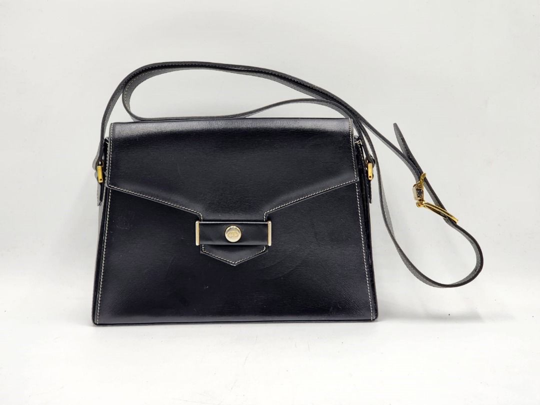 Christian Dior CD Logo Plate Trapezoid Crossbody Shoulder Bag (Category: Bags & Wallets) located in Melbourne. Submitted by designercollectibles.com.au (Listing ID 1341837401, Image 1). Description: Condition: Good. As this is a pre-loved item, there are scratches and tarnish on the hardware and general signs of wear. Please check the condition carefully from these pictures. Since this is a preloved item, there is a possibility that it has underg