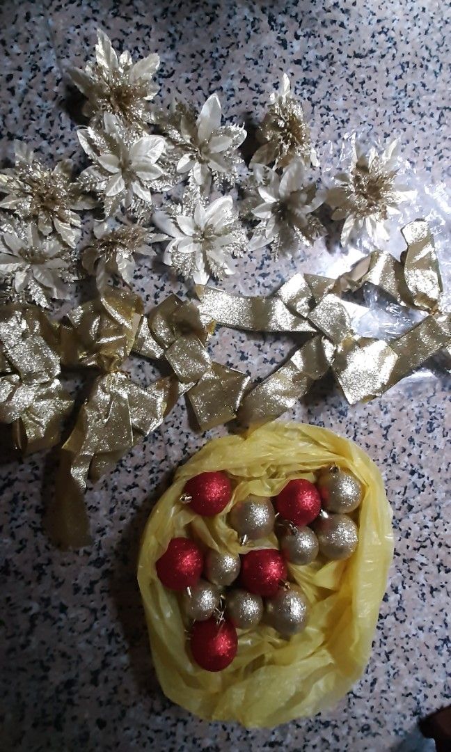 Christmas Decor Ornament 2 (Category: Other Home Decor) located in Pasig City. Submitted by itsdeclutter_time (Listing ID 1341777481, Image 1). Description: 10 gold flowers 5 large ribbons assorted glittery balls rfs: cant use them (glitters) coz i have a toddler mop: gcash or bpi pick: pasig or taguig by schedule.