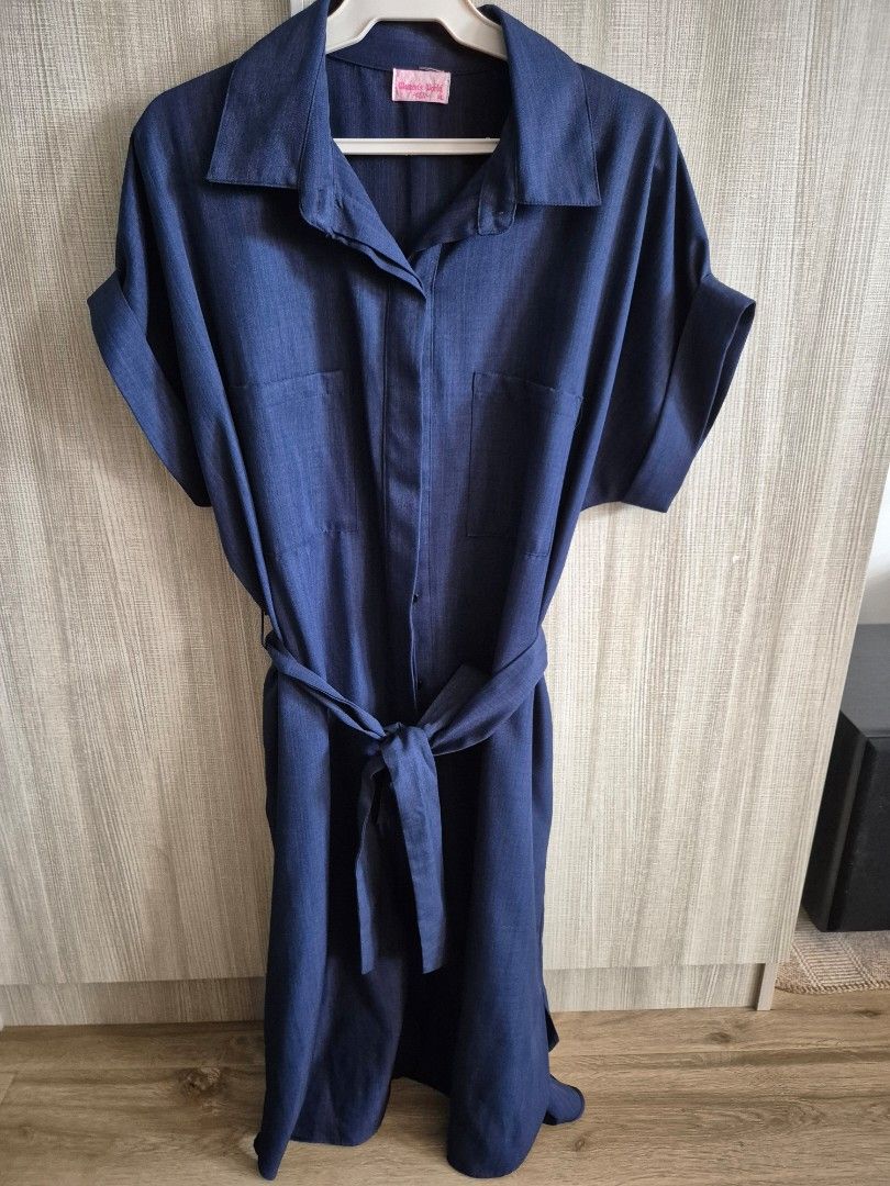Dark blue dress (Category: Dresses) located in Las Pinas. Submitted by fishbowling (Listing ID 1341796355, Image 2). Description: Dark blue dress, never used, washed and stored only. Bought in SM Dept store for 700+. RFS: wrong size :( Great for corporate wear. Tela is thick, cool, and very high quality..