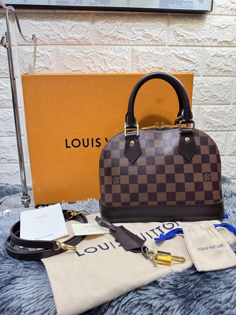 LV Bb Alma in Damier (Category: Luxury Bags & Wallets) located in Quezon City. Submitted by christineboller (Listing ID 1341914347, Image 1). Description: LV BB Alma in Damier In 9.9/10 condition, almost new. Complete, full inclusion with box, dustbag, 2 keys, lock, tag and strap for only Php85k.