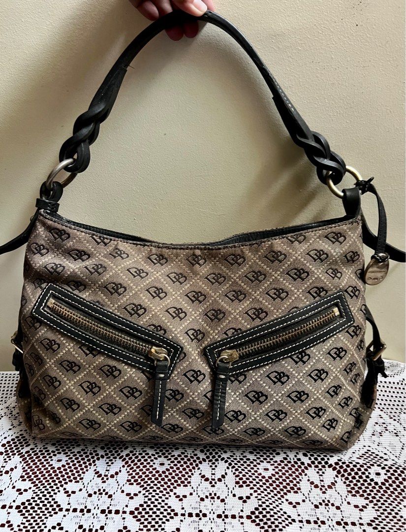 Original Dooney & Bourke Monogram Shoulder Bag not Longchamp Coach (Category: Shoulder Bags) located in Cavite. Submitted by Junells_Nook (Listing ID 1341915012, Image 1). Description: Mostly stored , normal signs of use with no major flaw Measures 10”H at the side x 16”L x 4.5” Width at the Base with 9” Handle Drop that has a braided design Leather handle and accents Last price posted already Not Lacoste Coach Spade Jacobs Kors .