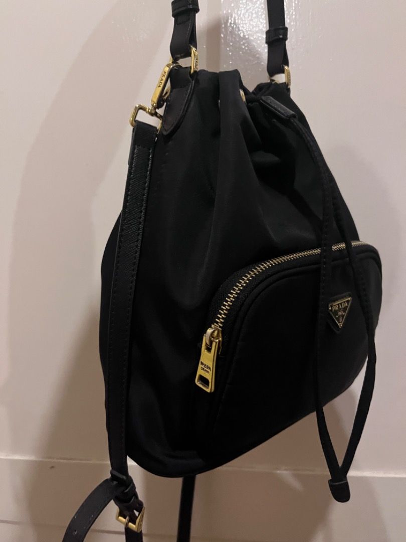 Prada Nylon bucket bag (Category: Luxury Bags & Wallets) located in Quezon City. Submitted by docagillemontemayor (Listing ID 1336615437, Image 2). Description: CODED💯 LAMPO ZIPPER💯 WITH CARECARD💯 ARTISTA BAG🤩 gamit nila Anne Curtis, Kathryn Bernardo, Isabelle Daza and other Celebrities!💖 NGA📌 One of my favorite bag kse very spacious sya inside and superb looking! Kahit anong outfit bagay to😍 DISCLAIMER: We are not associated or affiliated