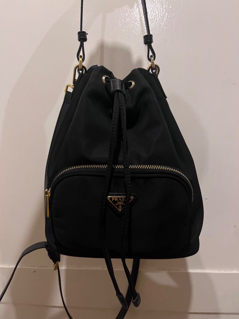 Prada Nylon bucket bag (Category: Luxury Bags & Wallets) located in Quezon City. Submitted by docagillemontemayor (Listing ID 1336615437, Image 1). Description: CODED💯 LAMPO ZIPPER💯 WITH CARECARD💯 ARTISTA BAG🤩 gamit nila Anne Curtis, Kathryn Bernardo, Isabelle Daza and other Celebrities!💖 NGA📌 One of my favorite bag kse very spacious sya inside and superb looking! Kahit anong outfit bagay to😍 DISCLAIMER: We are not associated or affiliated