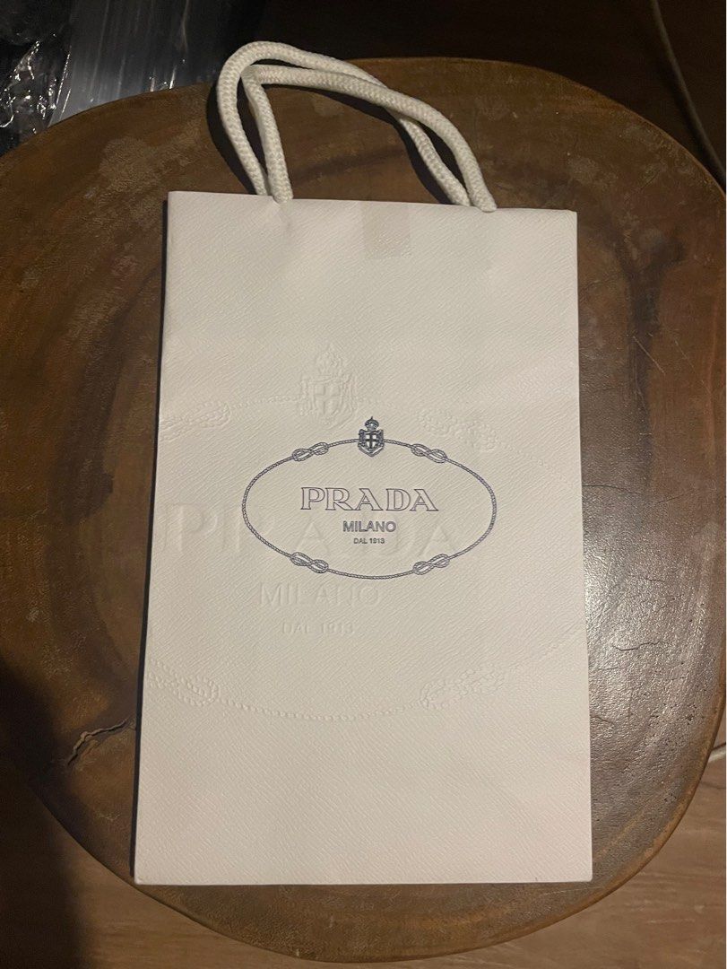 Prada small paper gift bag (Category: Luxury Bags & Wallets) located in Bacoor. Submitted by yournewfavorite (Listing ID 1341921015, Image 1). Description: L: 9.9 in W: 6.1 in.