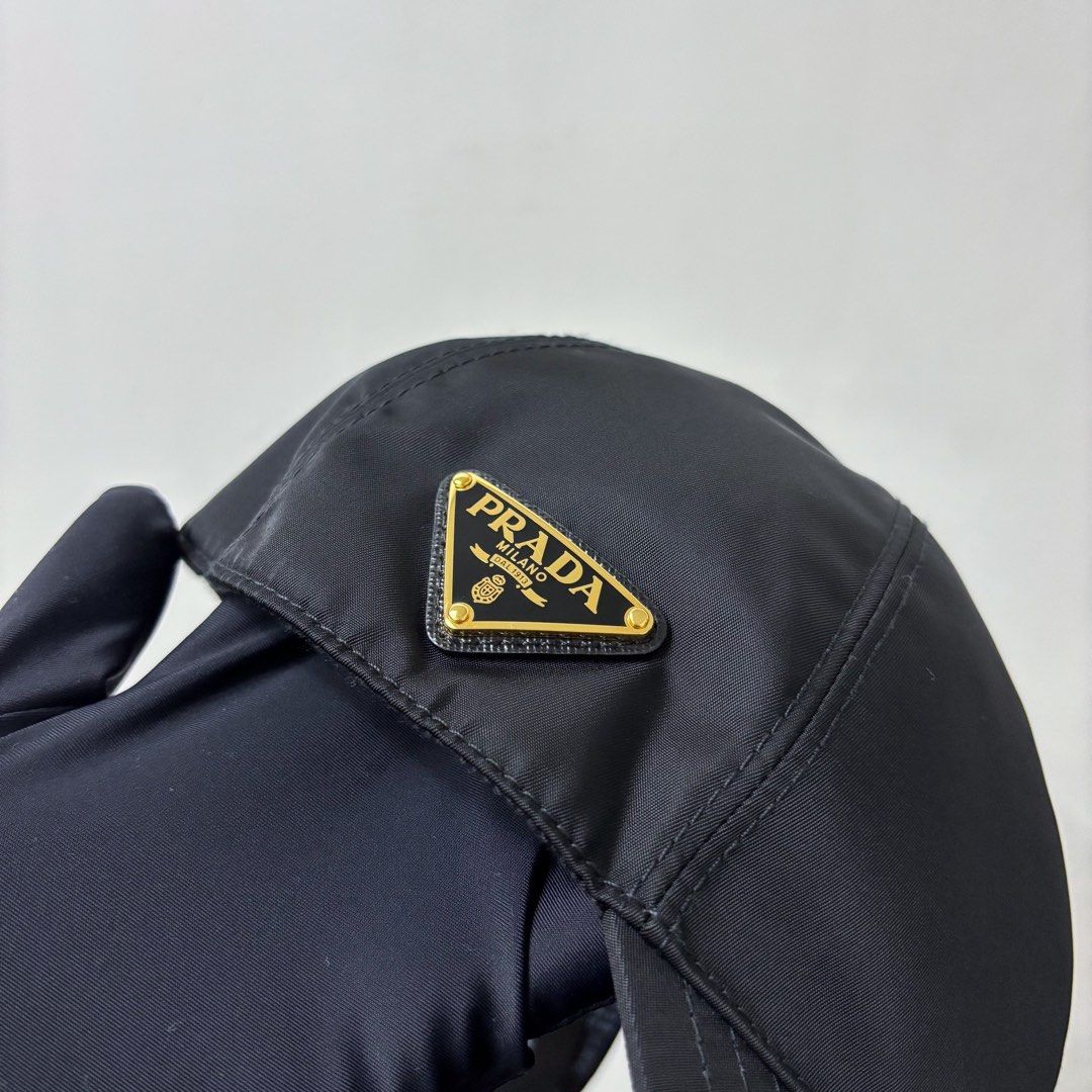 Authentic Prada Re-nylon Baseball Cap Gold Hardware (Category: Caps & Hats) located in Taguig. Submitted by slggg (Listing ID 1342062020, Image 2). Description: Prada Re-nylon Baseball Cap in Gold Hardware. Rare item! Bought last August 2024. Microchipped. You can check with NFC tools Includes: - Dust bag and felt paper Meet up: Taguig/BGC area.