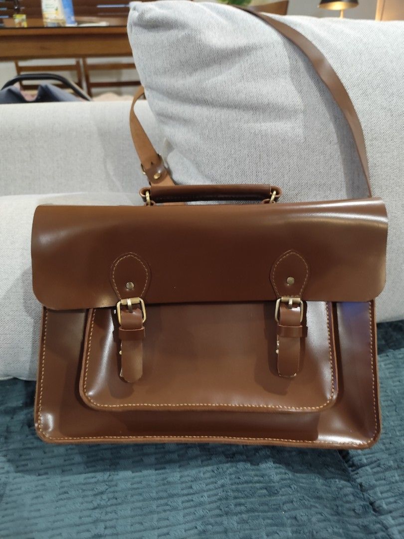 Brown Satchel Bag - Leather 13"x9"x3" (Category: Shoulder Bags) located in Cavite. Submitted by ubuy05 (Listing ID 1342050921, Image 2). Description: Brown Satchel Bag - Leather 13"x9"x3" with Bag cloth available for delivery.