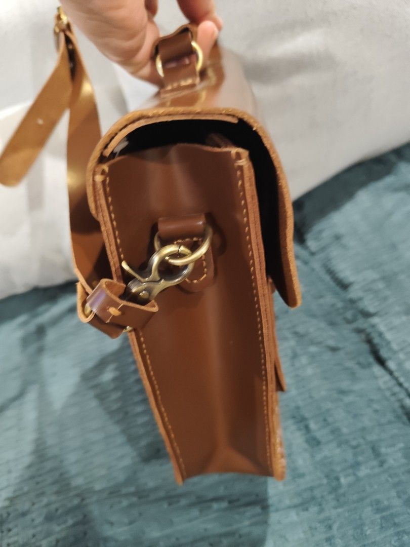 Brown Satchel Bag - Leather 13"x9"x3" (Category: Shoulder Bags) located in Cavite. Submitted by ubuy05 (Listing ID 1342050921, Image 3). Description: Brown Satchel Bag - Leather 13"x9"x3" with Bag cloth available for delivery.