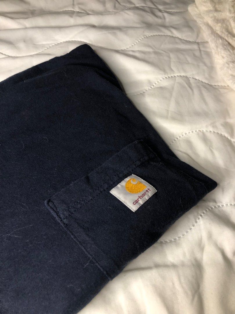 CARHARTT Original Fit w/ pocket (Category: Tshirts & Polo Shirts ) located in Las Pinas. Submitted by junkdrawers (Listing ID 1342038006, Image 1). Description: - 2 of the exact same carhartt shirts on hand - decent quality but w/ slight print fades due to use - shirt is a very dark blue for any inquiries or concerns, kindly contact the seller 🩷 ….thank you📮💌 !…...