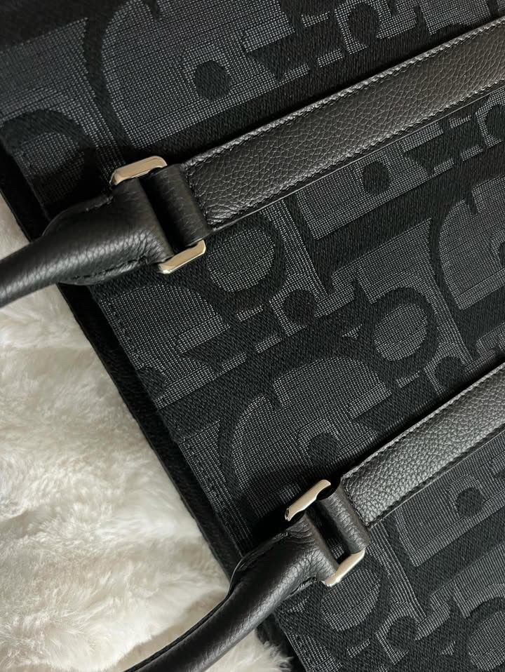 Dior East-West Tote Bag (Category: Luxury Bags & Wallets) located in Makati City. Submitted by clockbykent (Listing ID 1341994697, Image 3). Description: Almost brand-new Bought in Dior, 5th Ave., NYC Everything except of the box (Strap, card, receipt, dust bag) Meet up in Quezon City (Tomas Morato Ave.).