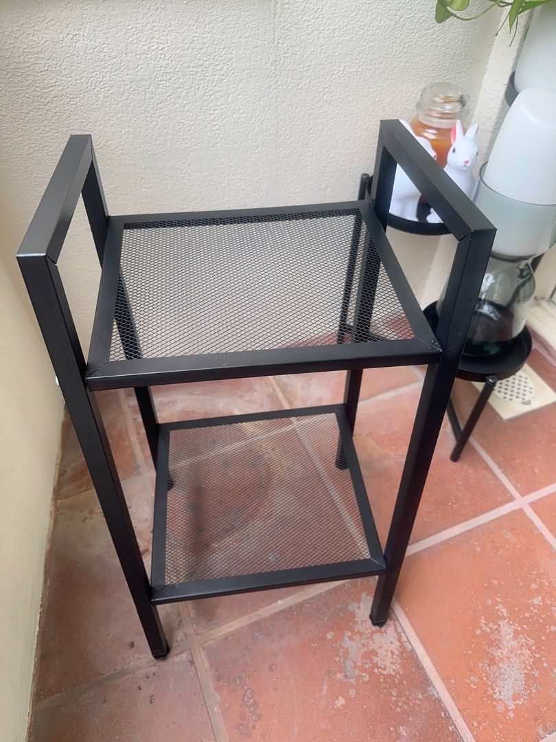 Rack (Category: Shelves, Cabinets & Racks) located in Singapore. Submitted by jazzarene (Listing ID 1341973813, Image 3). Description: Black 2-Tier Metal Shelf • Sleek, modern design with mesh shelves • Compact and sturdy, perfect for small spaces • Ideal for organizing plants, books, toiletries or household items • Dimensions: 66cm (h) x 36cm (width) x 26cm (depth) • Condition: Gently used, great condition Price: $10 Location: Pick up at Tanjong