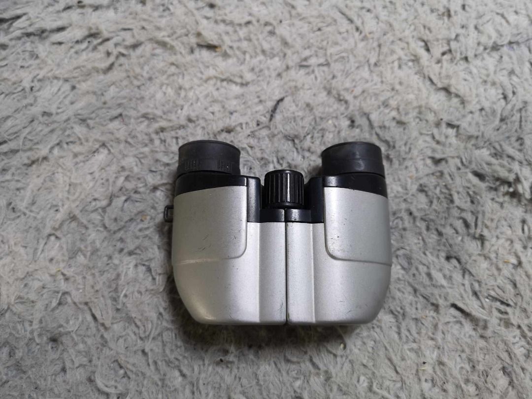 Silver Compact Binocular (Category: Lens & Kits) located in Santa Cruz. Submitted by jmy_surplus.2 (Listing ID 1341987760, Image 1). Description: Size ; L - 11cm W - 9cm Color ; Silver Type ; Binocular Brand ; No brand Material ; Plastic Style ; Silver Compact Binocular LG 96 JMY 4.