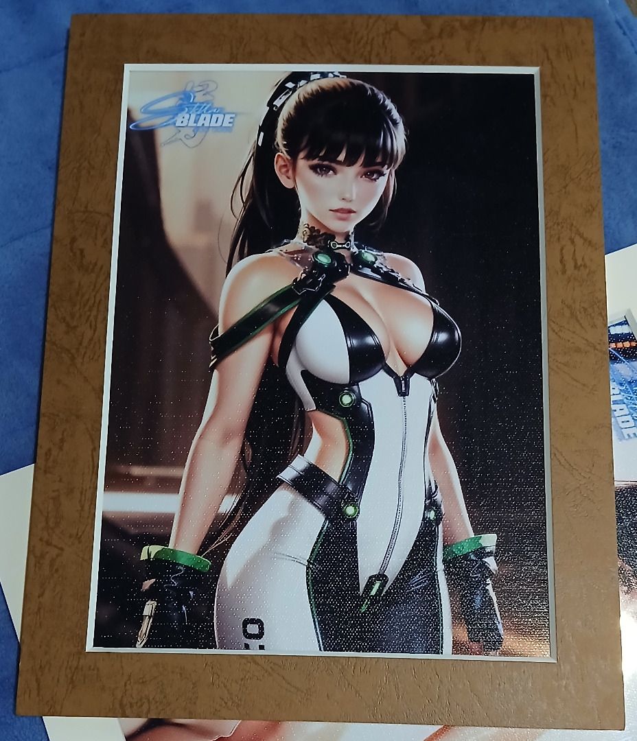 Stellar Blade Framed Posters (Category: Art & Prints) located in Iloilo. Submitted by jrmagallanes78 (Listing ID 1342121876, Image 2). Description: Framed image of Eve from the game Stellar Blade. 300Php per framed picture. Dimensions: Frame outer dimension: 232mm X 337mm) Image dimension: near B5 size (182mm x 252mm) Material: Paper, Very thick paper.