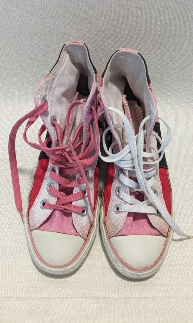 Pink Chuck Taylors High Tops (Category: Sneakers) located in Mandaluyong City. Submitted by clf97 (Listing ID 1342171687, Image 2). Description: Patchwork pink and white chucks, practically no wear on sole. Converse decal starting to peel off from storage. US women size 6. Rubber and fabric still good. Some yellowing with age..