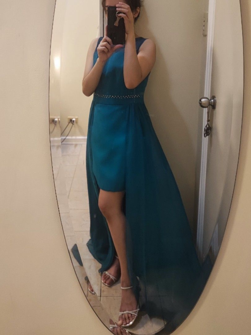 Blue green/Teal Evening Gown (Category: Evening dresses & gowns) located in Quezon City. Submitted by chicolim (Listing ID 1342429318, Image 1). Description: Used once Bought for Php 5,000 from a boutique store Fits S-M Model stats: 32-27-35 Gown measurements: 34-30-40 (widest part) Good condition RFS: not being used Price negotiable.