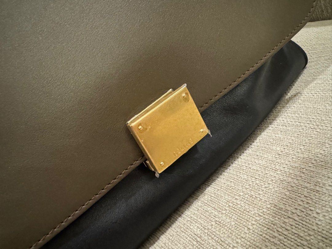 Celine Trapeze (Category: Luxury Bags & Wallets) located in Quezon City. Submitted by newbieandoldie (Listing ID 1342448471, Image 2). Description: Bag lock hardware newly changed (Still with stickers & receipt of repair from celine hk) RFS : decluttering Comes with dust bag & receipt .