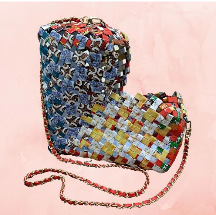 Lovebound (Category: Cross-body Bags) located in Singapore. Submitted by bcaresg (Listing ID 1342430012, Image 1). Description: Heart-shaped sling bag Dimensions: W: 30 cm, H: 23 cm This charming heart-shaped bag is handcrafted from recycled materials, featuring a vibrant and colorful woven design. This bag is lovingly made by our dedicated volunteer, Melody. A senior herself, she discovered this upcycled craft while searching for a hobby – and s
