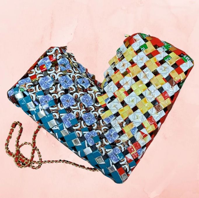 Lovebound (Category: Cross-body Bags) located in Singapore. Submitted by bcaresg (Listing ID 1342430012, Image 2). Description: Heart-shaped sling bag Dimensions: W: 30 cm, H: 23 cm This charming heart-shaped bag is handcrafted from recycled materials, featuring a vibrant and colorful woven design. This bag is lovingly made by our dedicated volunteer, Melody. A senior herself, she discovered this upcycled craft while searching for a hobby – and s