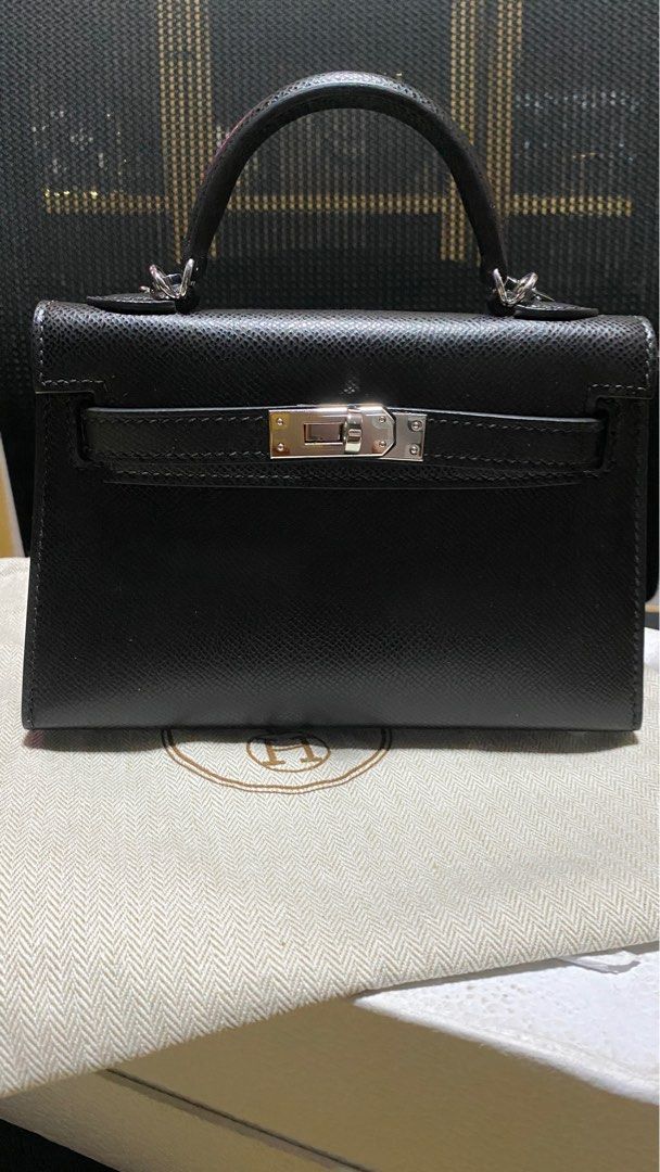Mini Kelly (Category: Luxury Bags & Wallets) located in Cavite. Submitted by awesome0022 (Listing ID 1342446539, Image 1). Description: Cheapest Mini Kelly in the Market Noir Black Slit pocket interior Epsom leather Palladium hardware With dust bag and twilly Brand new and never been worn Mini kelly that fits a passport and 16 pro comfortably. Delivery via lalamove Payment via BDO or Gcash Once purchased, no returns and no exchange and no refunds