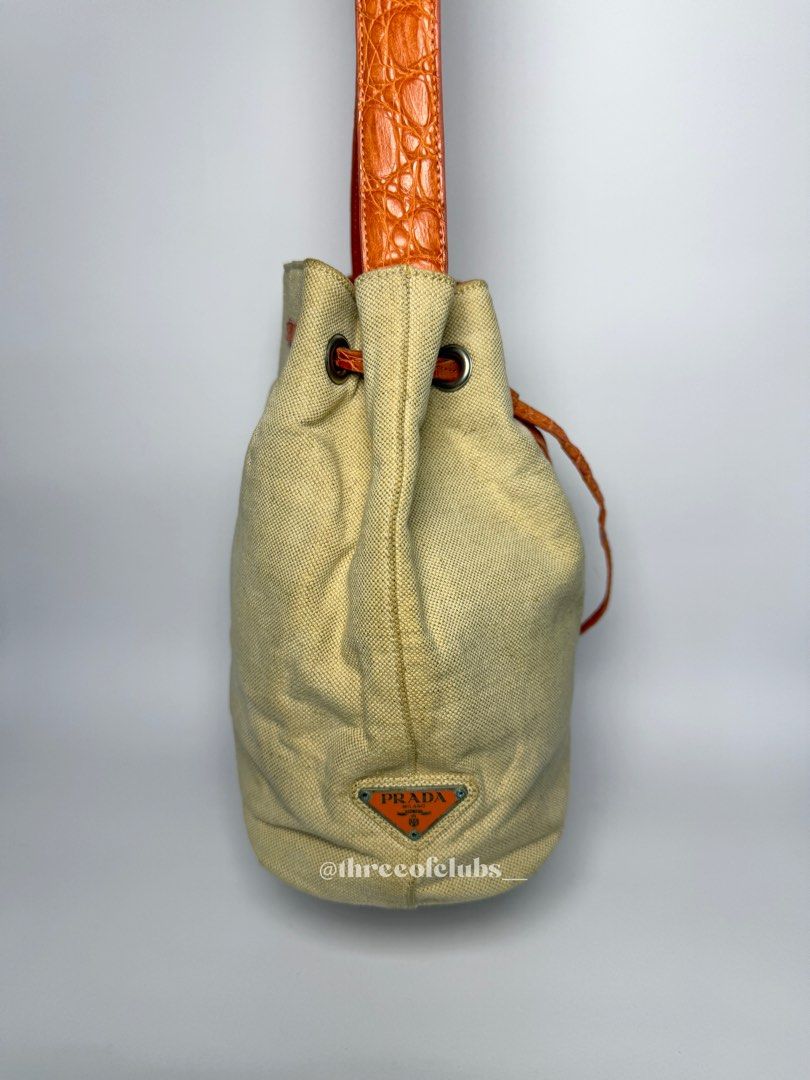 Prada Canvas in Cream and Orange Pattern Leather Bucket Bag (Category: Luxury Bags & Wallets) located in Quezon City. Submitted by threeofclubs__ (Listing ID 1342333416, Image 3). Description: Excellent-very good condition 100% GA Nice canvas body Clean interior Good strap with pattern No cracks No stains No rubs Minimal signs of usage always double check and zoom photos ♣ First to mine and send an order form basis. ♣ 1 day reservation only. ♣ Pl