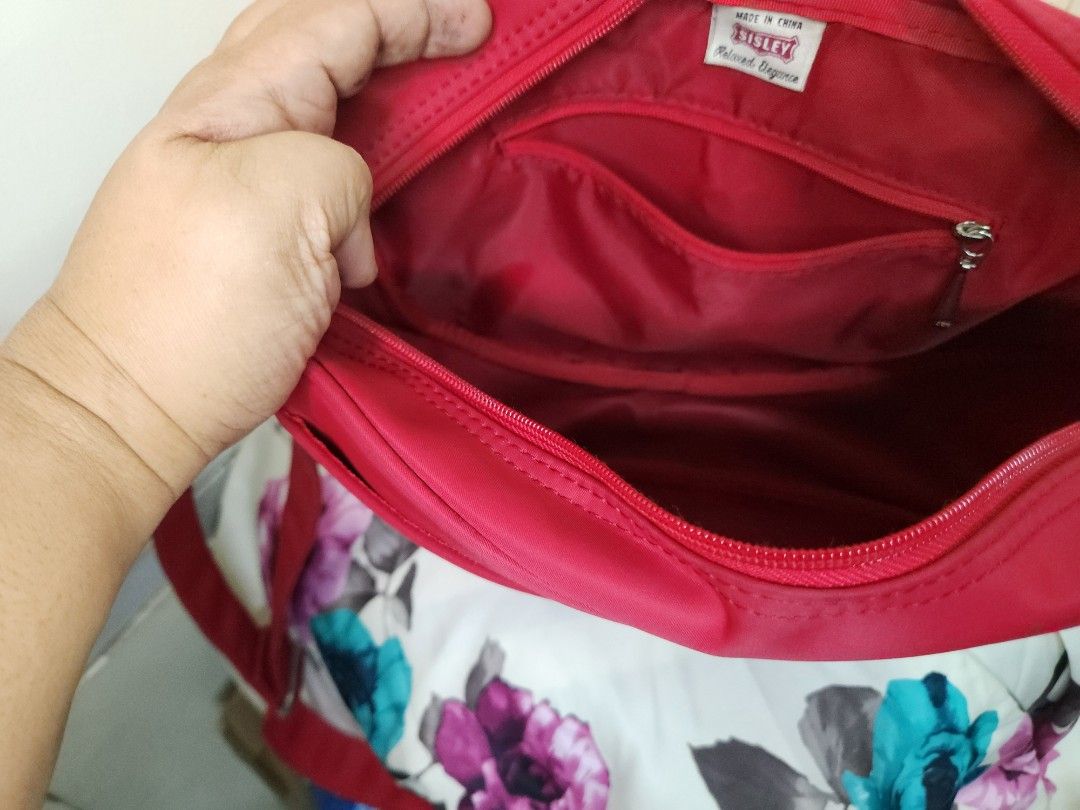 SISLEY RED NYLON SLING BAG (Category: Cross-body Bags) located in Taguig. Submitted by starbucksph (Listing ID 1342382003, Image 2). Description: authentic Sisley.