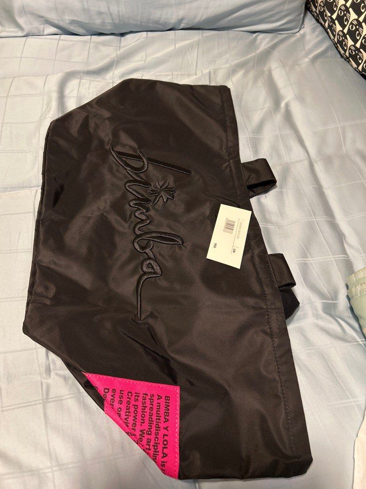 Gym Bag Bimba y Lola (Category: Tote Bags) located in Singapore. Submitted by mchris (Listing ID 1342682765, Image 1). Description: Size : 66x33x28cm If postal service required add $5.00 for padded envelope and normal mail and will mail out following day(Sun n PH exc) with photo proof after paymnt. Pls note bag will have to be folded to fit envelope..