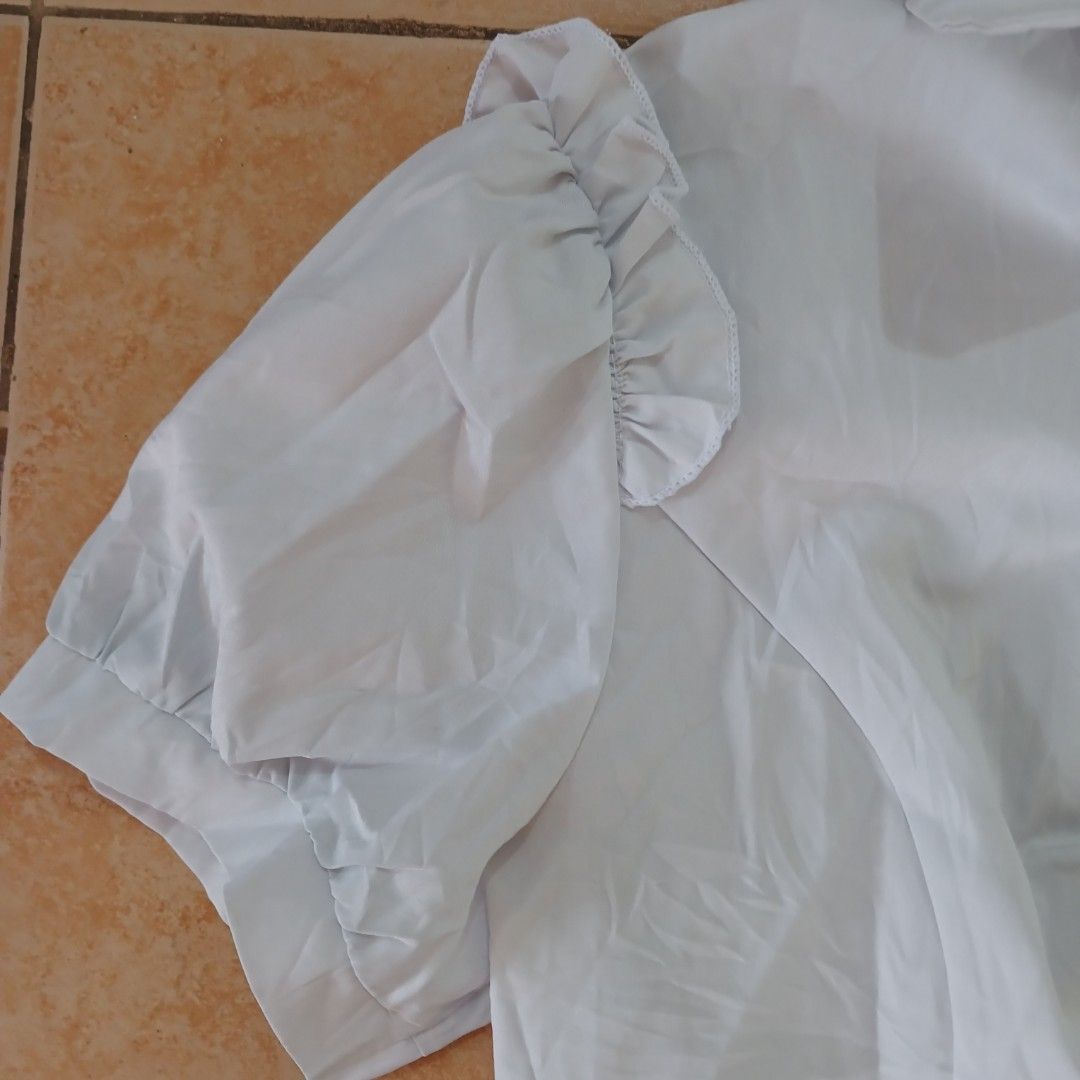 White buttondown (Category: Blouses) located in Manila. Submitted by planetaria03690 (Listing ID 1342542658, Image 3). Description: Cute White BTD (can be used for jirai kei tbh) Tags says L but fits S-M *thrifted Rfs: decluttering; not in NCR rn and will be bringing the items with me when I get back on January 4 MOP: Gcash Delivery: Lalamove c/o buyer.