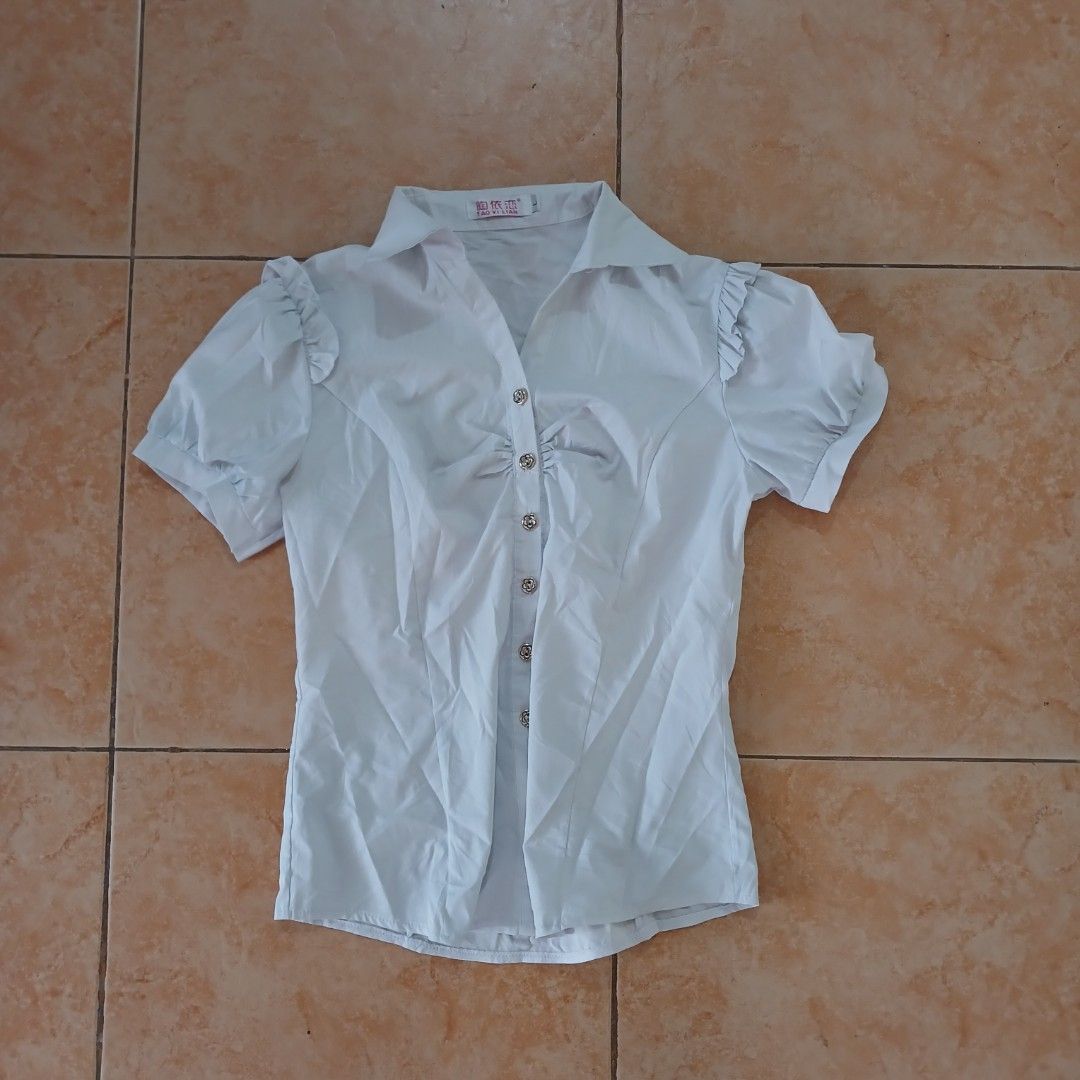 White buttondown (Category: Blouses) located in Manila. Submitted by planetaria03690 (Listing ID 1342542658, Image 1). Description: Cute White BTD (can be used for jirai kei tbh) Tags says L but fits S-M *thrifted Rfs: decluttering; not in NCR rn and will be bringing the items with me when I get back on January 4 MOP: Gcash Delivery: Lalamove c/o buyer.