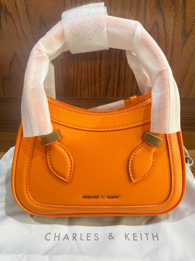 Bonnie Curved Tote Bag - Orange (Category: Shoulder Bags) located in Quezon City. Submitted by jaaappi (Listing ID 1339459523, Image 1). Description: Charles & Keith Bonnie Curved Tote Bag - with tag and dust bag - comes with detachable bag strap.