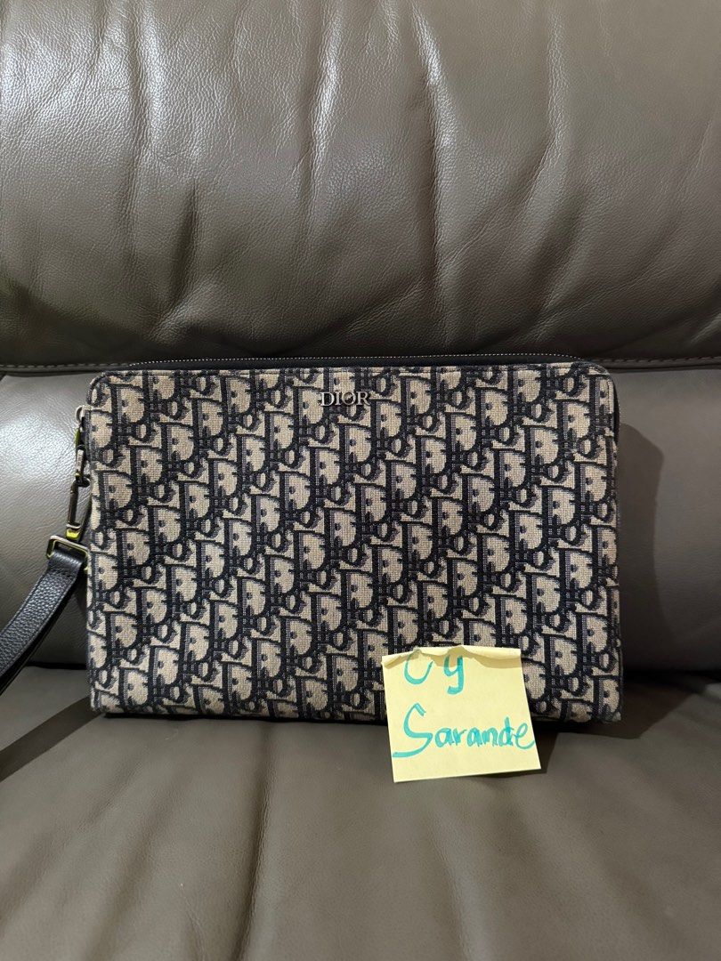 Dior oblique jacquard clutch (Category: Luxury Bags & Wallets) located in Makati City. Submitted by cysarande (Listing ID 1339543698, Image 1). Description: Interior patch pocket Removable leather strap Embossed dior interior Cardholder compartment inside.