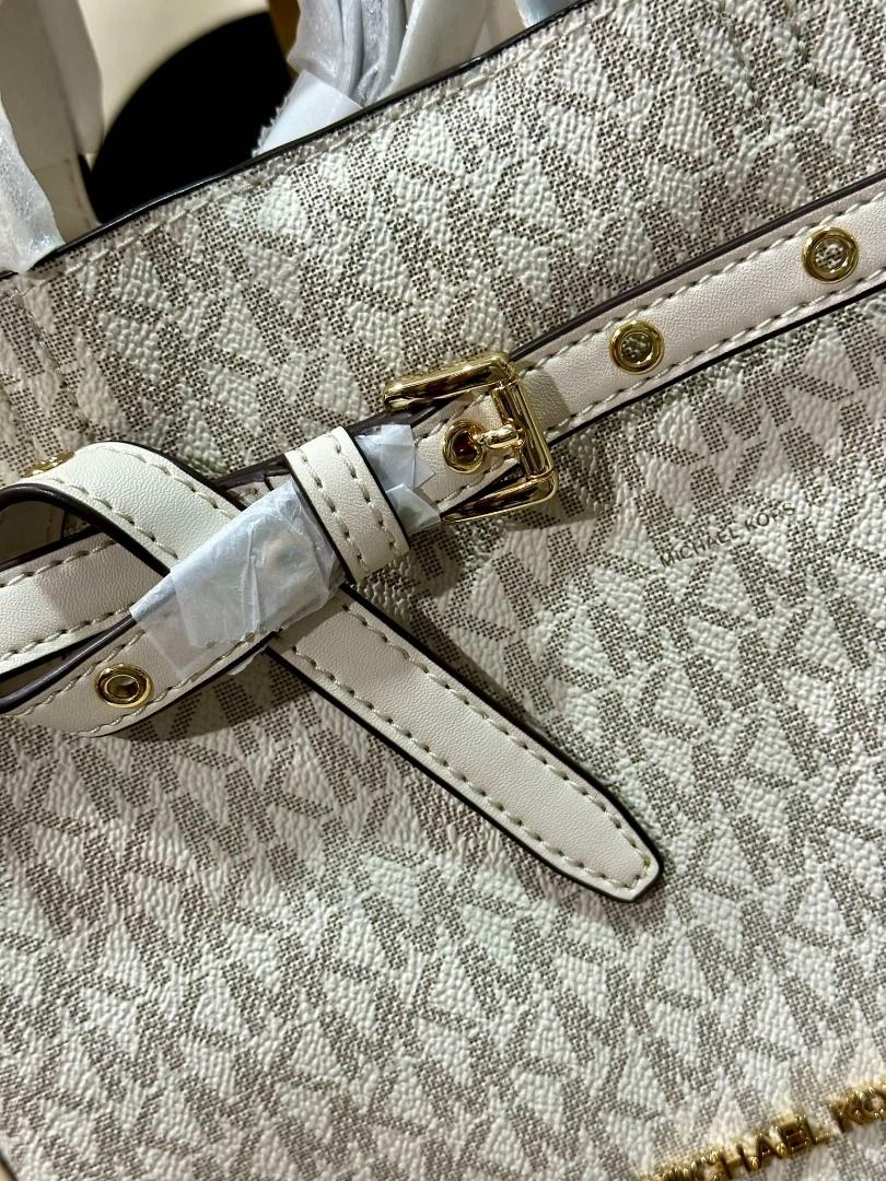 Michael Kors Emilia Small Logo Satchel (Category: Luxury Bags & Wallets) located in Las Pinas. Submitted by chicchateaumnl (Listing ID 1339383203, Image 2). Description: 100% Original Brand New With Tags With Care card Crafted from Signature-print canvas, this everyday handbag features a streamlined silhouette punctuated by a belted detail and gold-tone hardware. Detach the crossbody strap to carry yours by the top handles. Satchel Logo-print can