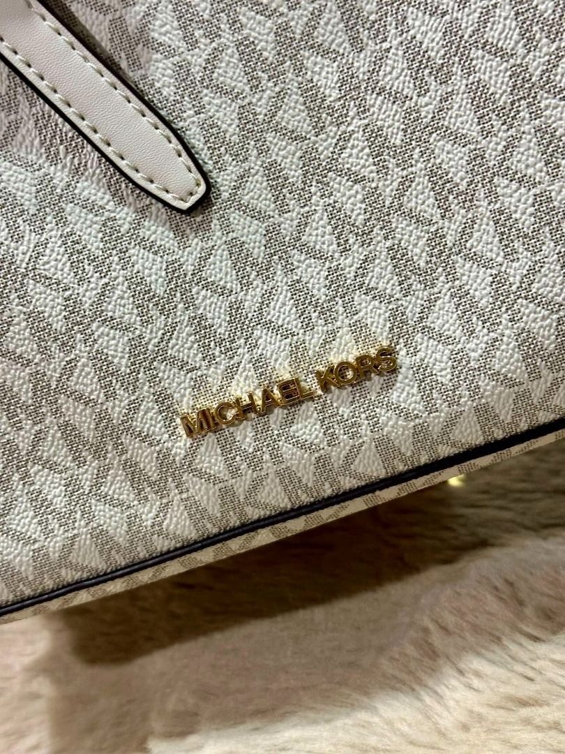 Michael Kors Emilia Small Logo Satchel (Category: Luxury Bags & Wallets) located in Las Pinas. Submitted by chicchateaumnl (Listing ID 1339383203, Image 3). Description: 100% Original Brand New With Tags With Care card Crafted from Signature-print canvas, this everyday handbag features a streamlined silhouette punctuated by a belted detail and gold-tone hardware. Detach the crossbody strap to carry yours by the top handles. Satchel Logo-print can