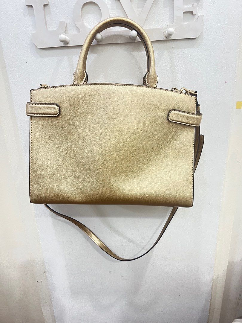 Michael Kors sling/hand bag in Gold (Category: Luxury Bags & Wallets) located in Pasig City. Submitted by true_solutionx (Listing ID 1339464528, Image 2). Description: Michael Kors Sling/Hand bag in Gold Two Big compartments Bought in US.