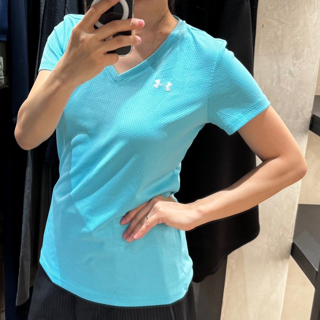 Under Armour blue running shirt (Category: Activewear) located in San Juan City. Submitted by steffchua (Listing ID 1339480527, Image 1). Description: Original pice ₱1,200 Model is 5’ 6” and size small for reference.