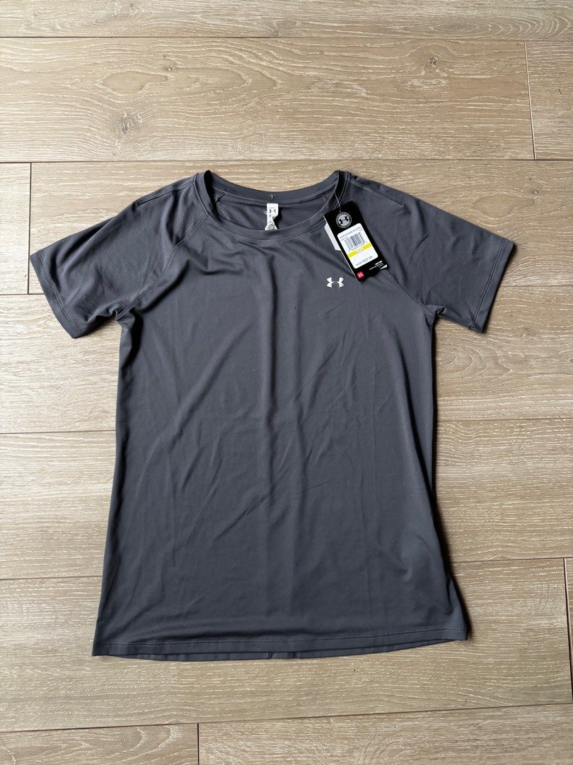 Under Armour gray running shirt (Category: Activewear) located in San Juan City. Submitted by steffchua (Listing ID 1339480296, Image 2). Description: Loose fit Original price ₱1,200 Model is 5’ 6” and size small for reference.