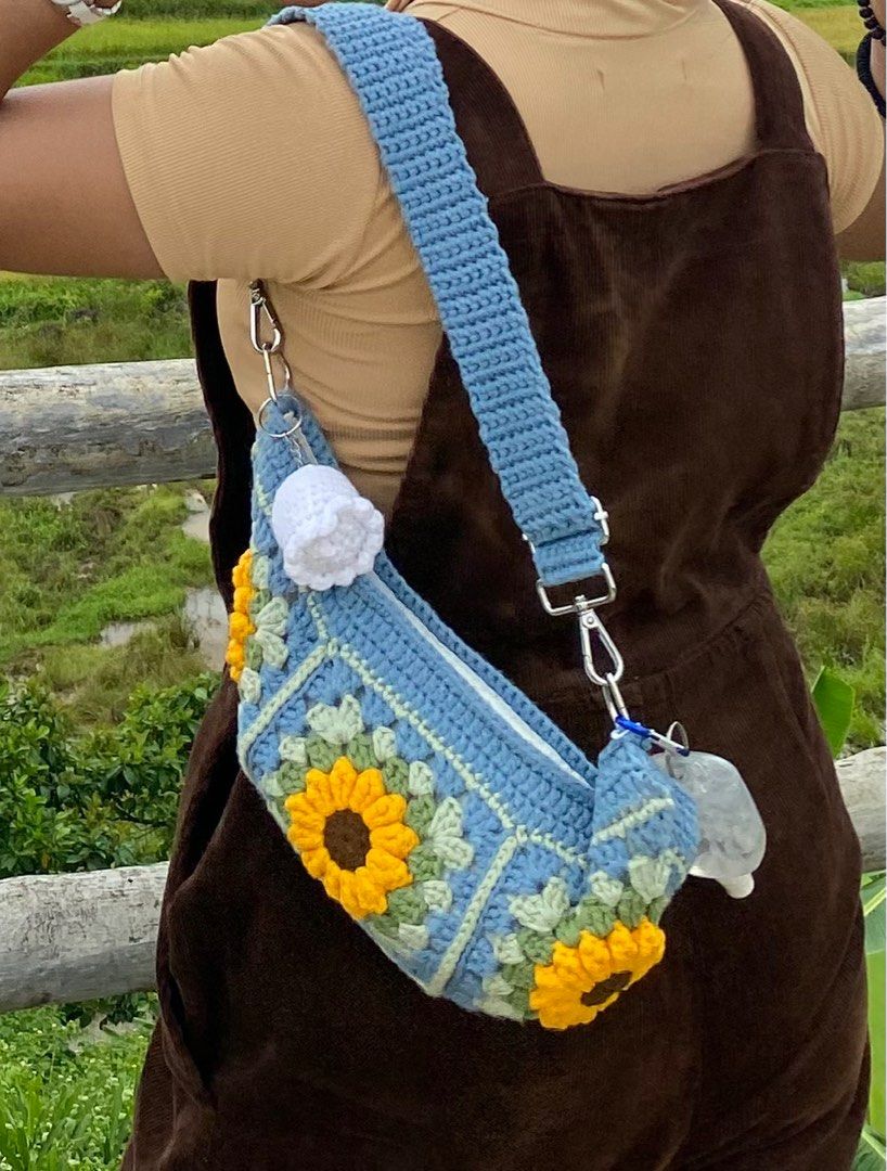 Cute Crochet Floral/Sunflower Patchwork Baguette Bag (Category: Shoulder Bags) located in Bacolod City. Submitted by sheezhbratzified (Listing ID 1342752864, Image 3). Description: ‼️PLEASE READ DESCRIPTION‼️ Good condition 🤩 No flaw 🤩 Brand: ARTIF•ICEE |Disclaimer: keychain & alcohol spray bottle not included| Small Size Bag Length: 6 inches Width: 12 1/2 inches Mode of payment: Gcash 💰 ‼️No COD (cash on delivery)‼️ Mode of shipment: j&t 📦 *