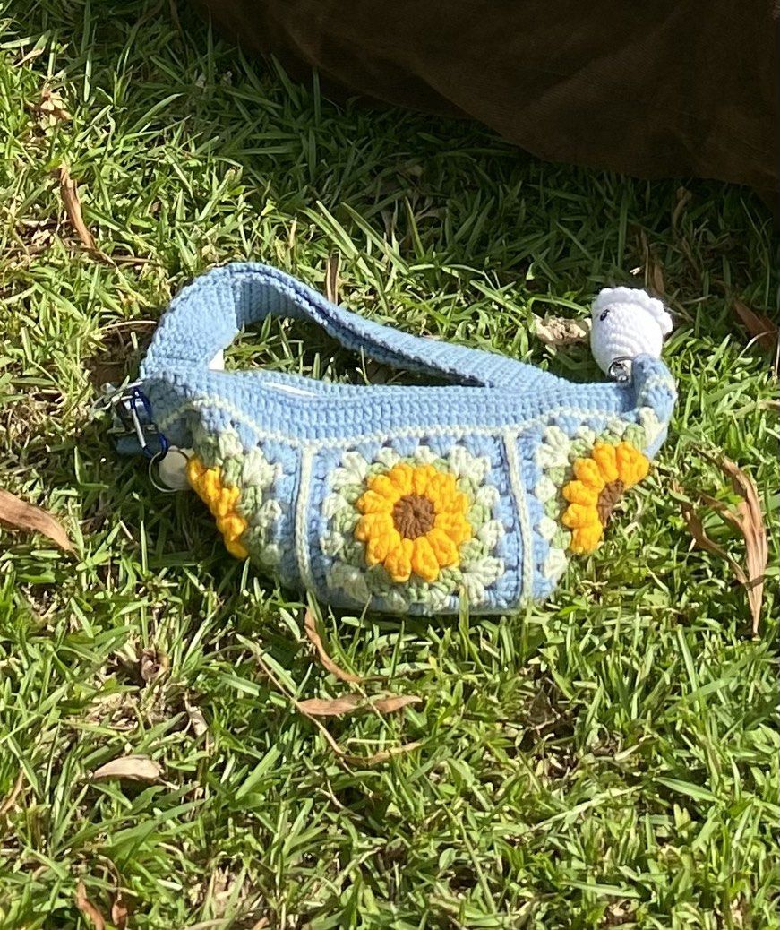 Cute Crochet Floral/Sunflower Patchwork Baguette Bag (Category: Shoulder Bags) located in Bacolod City. Submitted by sheezhbratzified (Listing ID 1342752864, Image 1). Description: ‼️PLEASE READ DESCRIPTION‼️ Good condition 🤩 No flaw 🤩 Brand: ARTIF•ICEE |Disclaimer: keychain & alcohol spray bottle not included| Small Size Bag Length: 6 inches Width: 12 1/2 inches Mode of payment: Gcash 💰 ‼️No COD (cash on delivery)‼️ Mode of shipment: j&t 📦 *